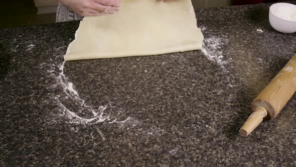 pie crust doughtop top layer placed over filling in pie baking pan