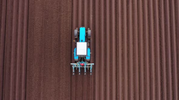 Tractor with Seeder in the Field