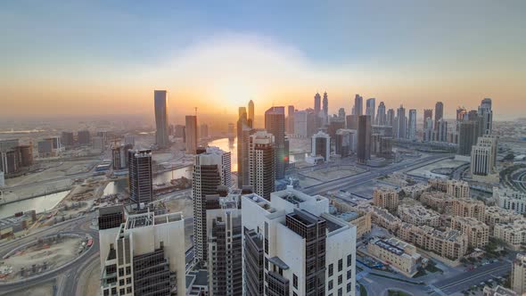 Scenic Aerial View of a Big Modern City with Sunset Timelapse