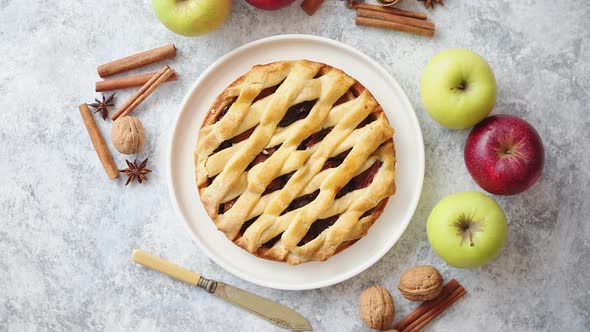 Tasty Sweet Homemade Apple Pie Cake with Cinnamon Sticks, Walnuts and Apples