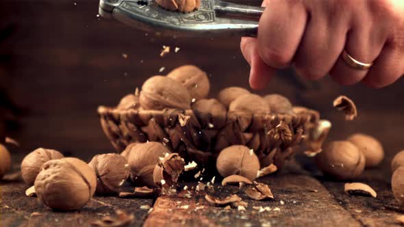 Super Slow Motion Male Hand Walnuts
