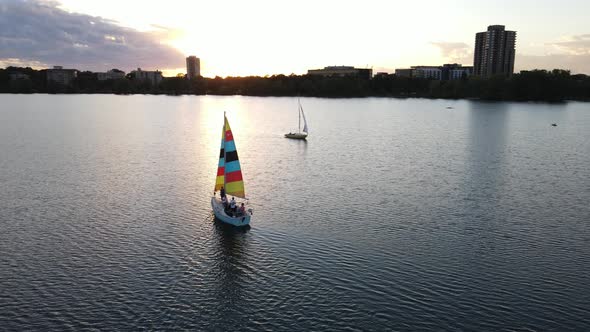 boats at Lake Bde Maka Ska during sunset in a summer evening, travel minnesota