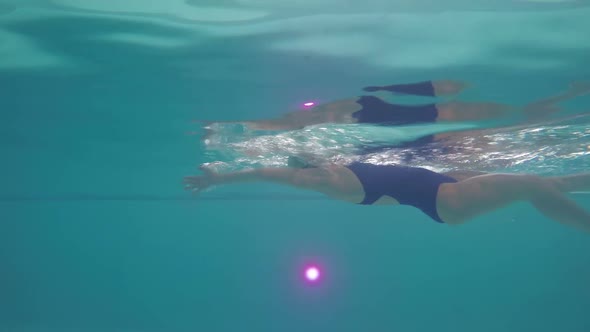 Female Athlete Swimming with Backstroke