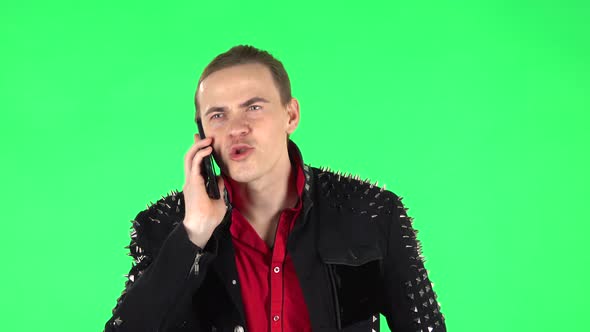 Guy Angrily Speaks on the Phone, Proves Something. Green Screen