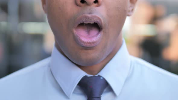 Face of Shocked African Businessman