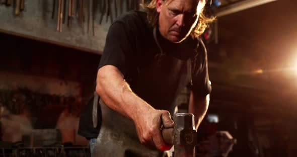 Blacksmith working on a iron rod