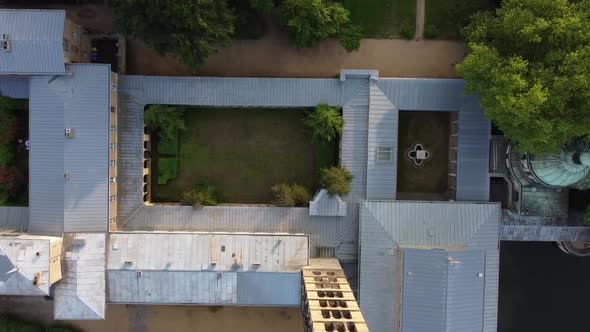 Fantastic aerial drone flight drone shot from above a symmetrical courtyard. Aerial drone view summ