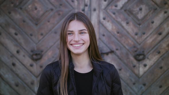 Portrait of Beautiful Young Woman with Attractive Smile