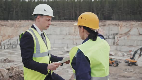 Quarry Supervisor and Manager Having Conversation