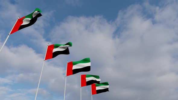 Waving Flags Of The United Arab Emirates blue sky