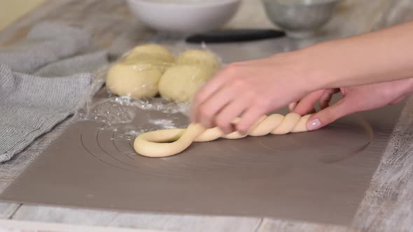 Woman Hands Cooking a Turkish Bagels Simit