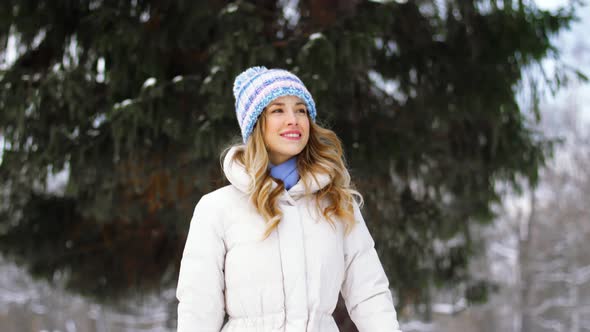 Happy Woman Walking in Winter Forest or Park 3