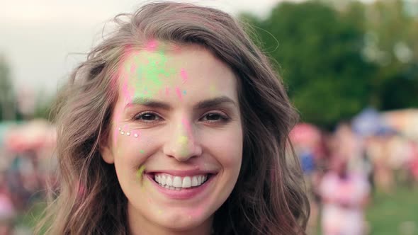 Happy woman in holi colors