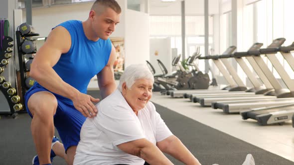 Elderly Pensioner Plays Sports in Gym