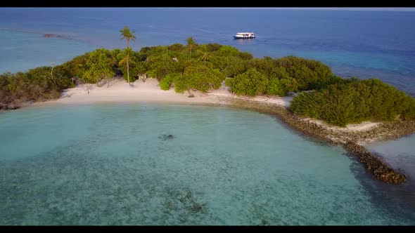 Aerial seascape of idyllic lagoon beach vacation by turquoise sea and white sandy background of a da