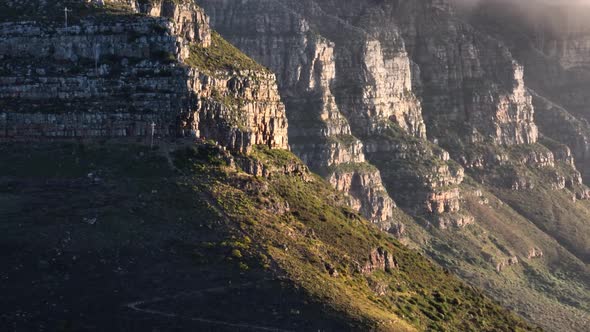 Sandstone mountainside of Twelve Apostles mountain range, Cape Town; drone
