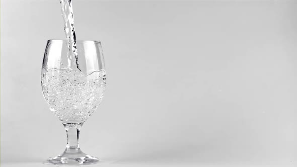 Super Slow Motion in the Glass Pours Clean Water