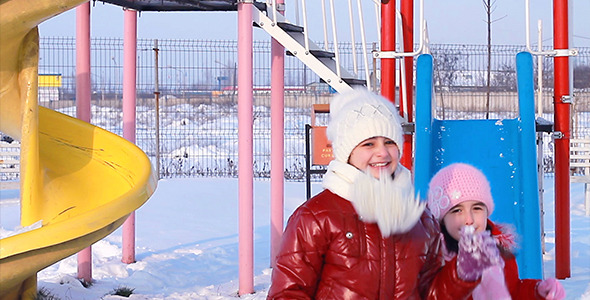 Sisters Playing in the Park in Winter