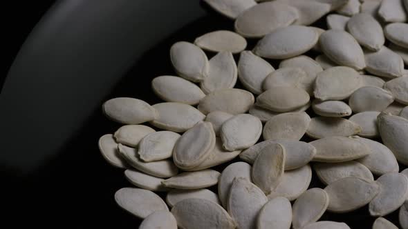 Cinematic, rotating shot of pumpking seeds - PUMPKIN SEEDS 010