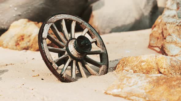 Old Tradition Waggon Wheel on the Sand