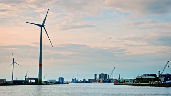 Wind Turbines in Antwerp Port on Sunset.