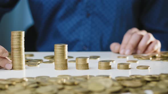 A Man Moves a Column of Coins