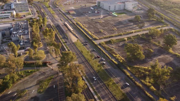 Coronel Roca Avenue at sunset in Buenos Aires city, Argentina. Aerial circling drone pov