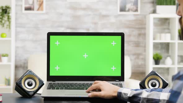 Laptop with Green Screen in Modern Flat