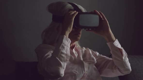 Senior woman in VR headset