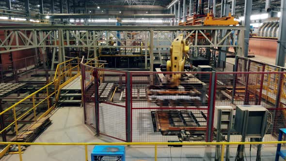 Robotized Industrial Complex, Robot Manipulator Worling at Modern Factory. Timelapse.