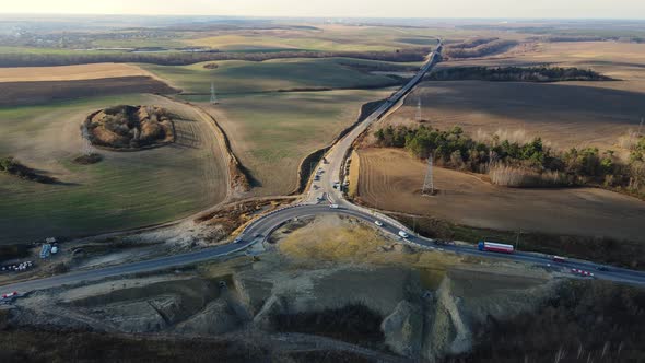 Unfinished Ring on the Road with Traffic