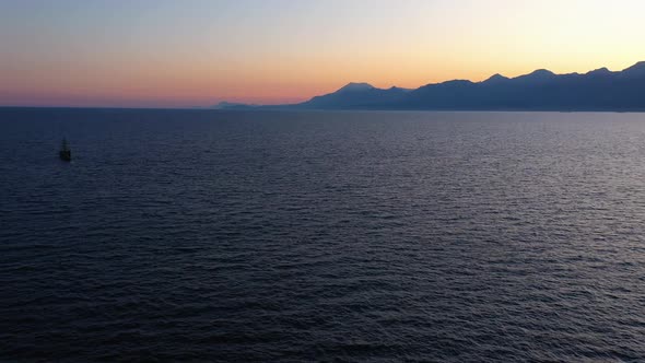 Evening Sunset Scenic View Over Sea and Mountains
