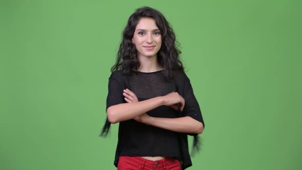 Young Beautiful Woman with Arms Crossed