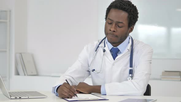 African Doctor Writing Prescription