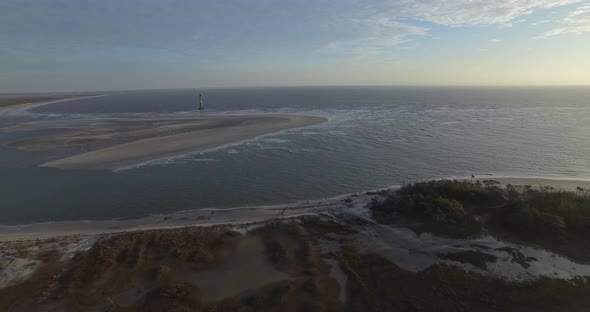 Aerial of Coastal Marsh with Lighthouse on Folly Beach