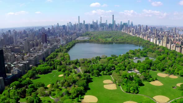 Aerial  Video Above Green Central Park in the Middle of Manhattan New York