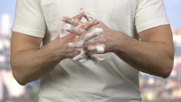 Portrait of Young Man Cleaning His Hands with Soap Foam