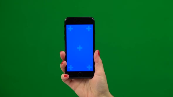 Holding Hand a Mobile Smartphone Blue Screen. Green Screen