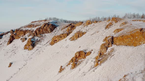 The Red Ridge rock Eastern slope of the Torgash ridge Winter Forest Cliffs Krasnoyarsk