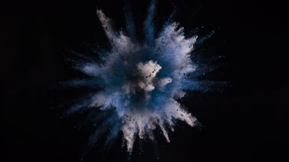 Super Slowmotion Shot of Blue Powder Explosion Isolated on Black Background