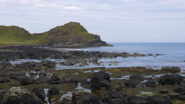 Waves On The Rocky Coast Near The Coastal Mountains And The Giant's Causeway In County Antrim, North