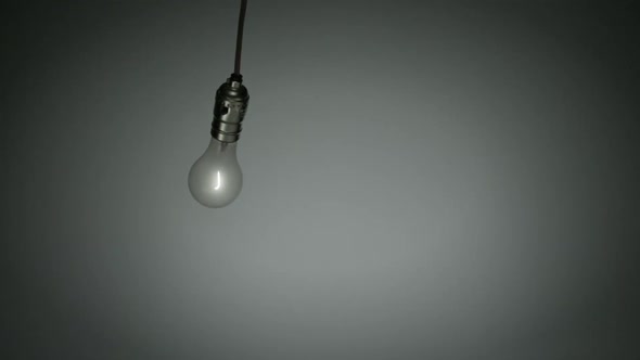 Light bulb hanging in the air, Slow Motion