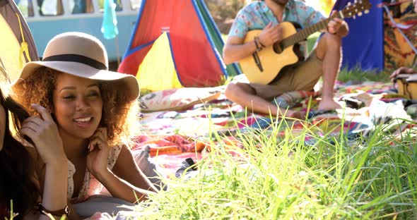 Hipster friends playing music and singing