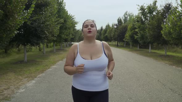 Fat Girl Runs Along the Road