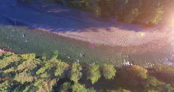 Low Altitude Flight Over Fresh Fast Mountain River with Rocks at Sunny Summer Morning