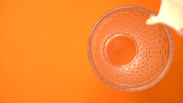 Fresh Milk Poured in the Glass From Top View