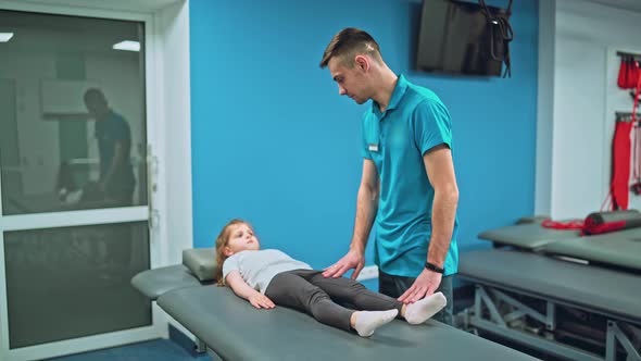 Young Girl Doing Exercises Under Physiotherapist Supervision