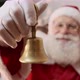 Santa Claus ringing a small bell. Jingle Bells. Savings on purchases. - VideoHive Item for Sale