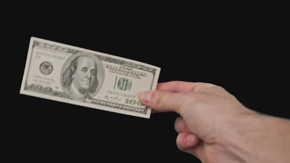 100 American Dollar in Male Hand with Alpha Channel
