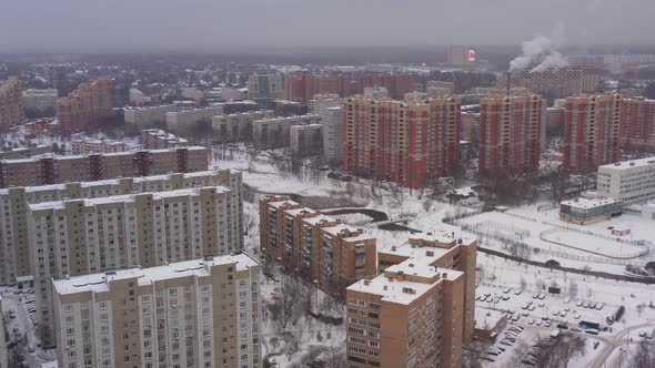 The River in the Middle of Modern Houses of the Sleeping Area in Winter